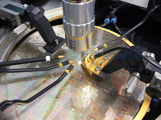 A wafer in measuring mode under tips, i.e. researchers are testing the performance of the circuits before they are cut out and encapsulated. © IMS